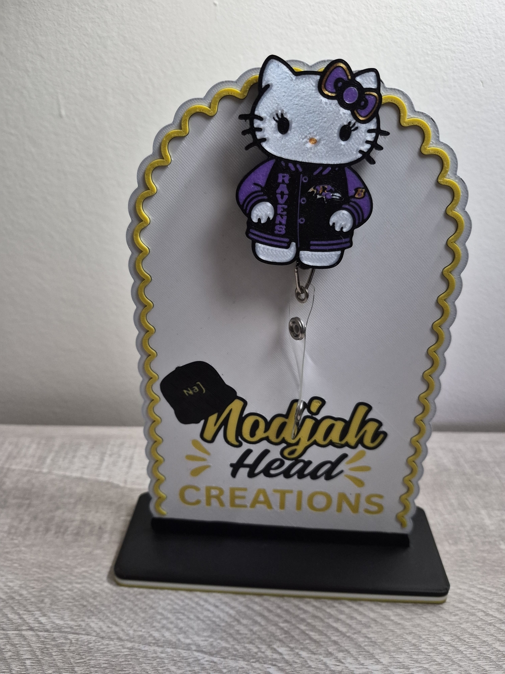 Hello Kitty Purple and White Ravens Badge Reel with Gold Trim